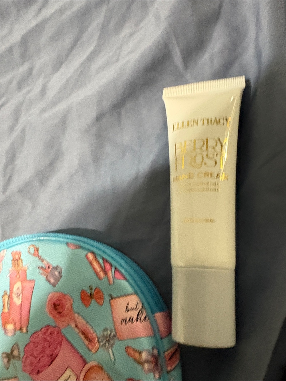 Blue Cosmetic Makeup Bag with Fun Print and assorted make up. - Picture 3 of 16